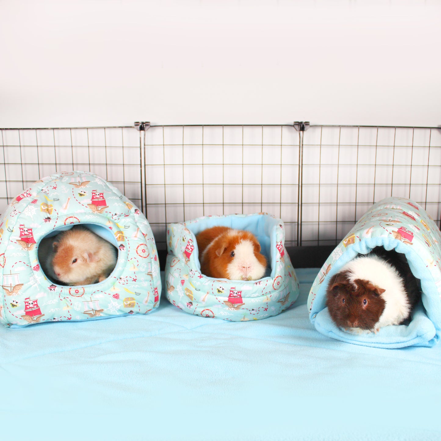 Pirate Themed Guinea Pig Accessory Bundle, full fleece accessory set inside a cage with guinea pig using them