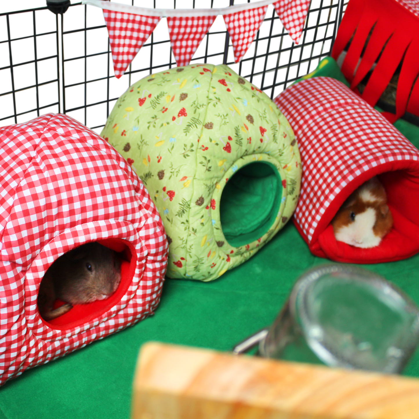 Red Gingham Guinea Pig Accessory Set, image showing the accessories in a cage with the guinea pigs using the accessories