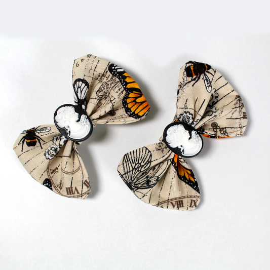 Pair Of Steampunk Butterfly Hair Bows, close up view of the hair clips  showing the details
