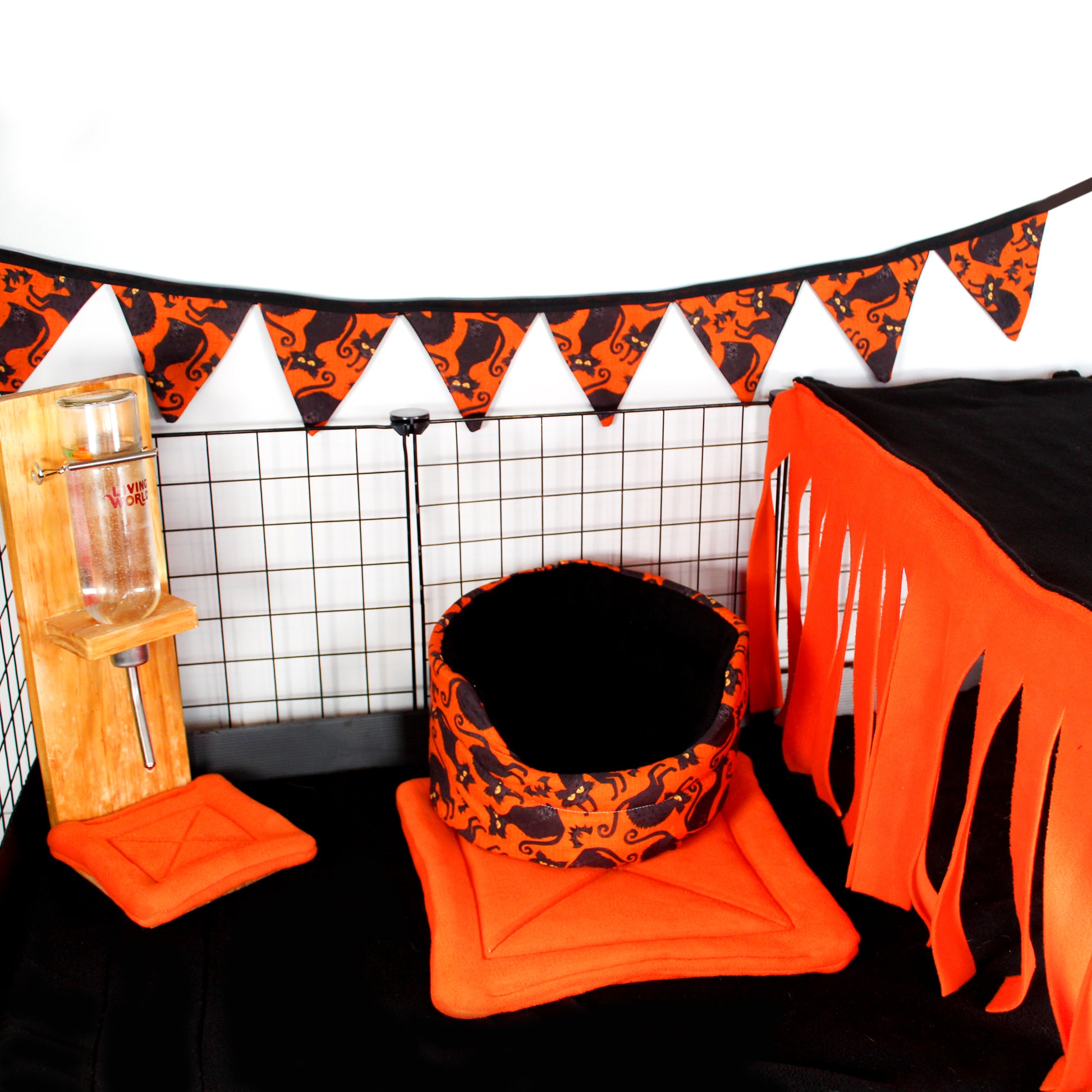 Orange and Black Large Fleece Forest, in a halloween themed cage