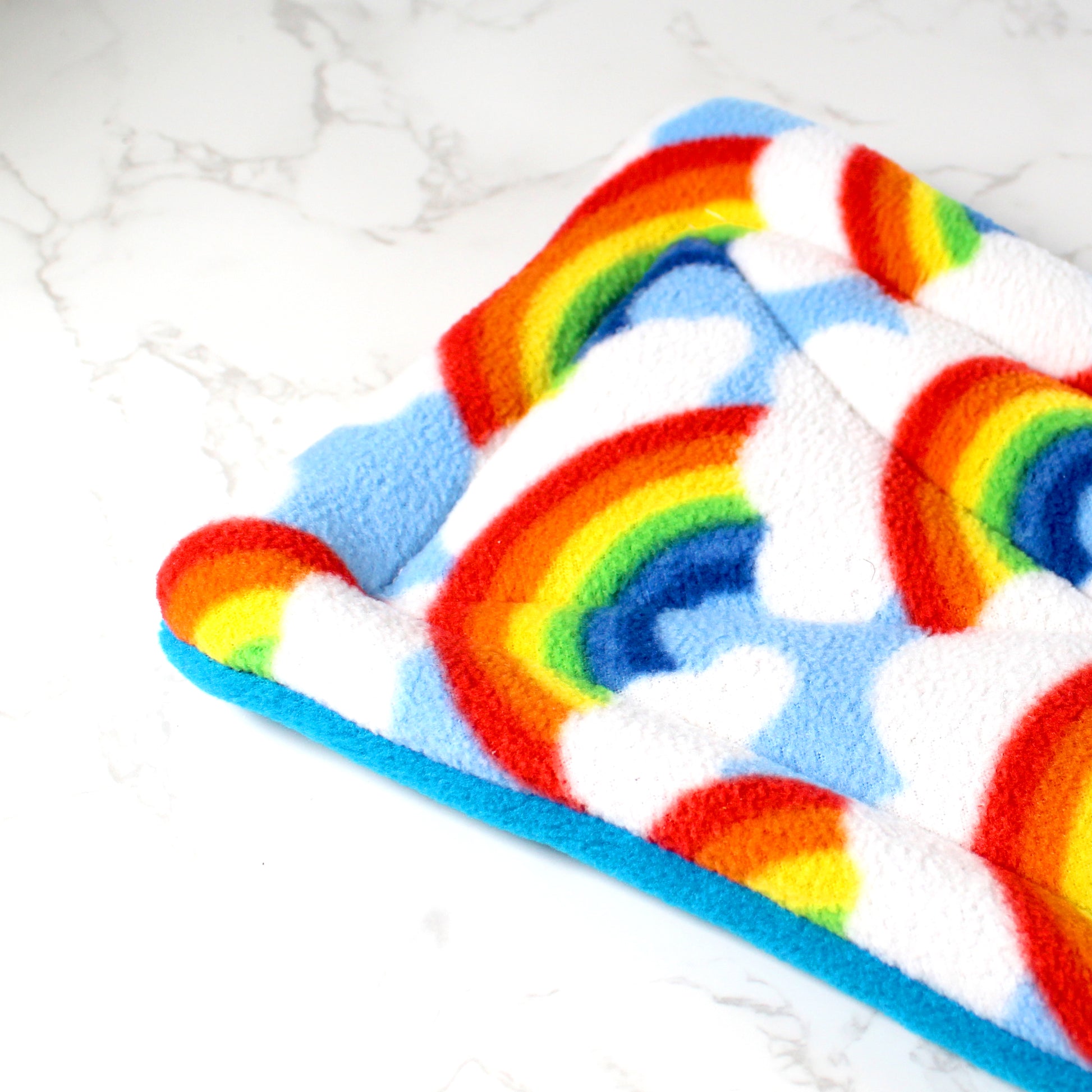 Rainbow Guinea Pig Squish Tunnel, close up of the rain bow fleece pattern