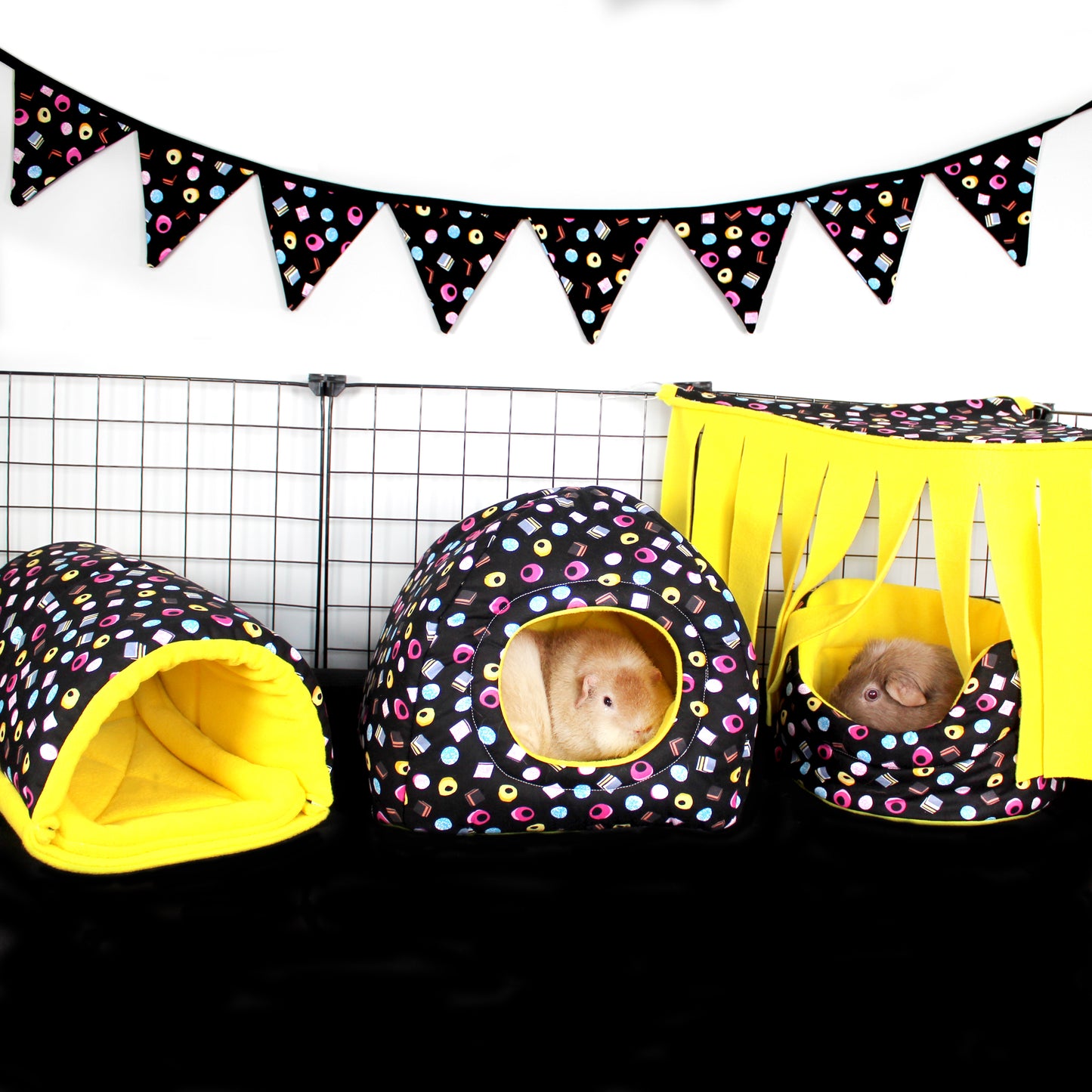 Large Liquorice Allsorts Bunting, hung over a guinea pig cage to show how it add to the overall theme